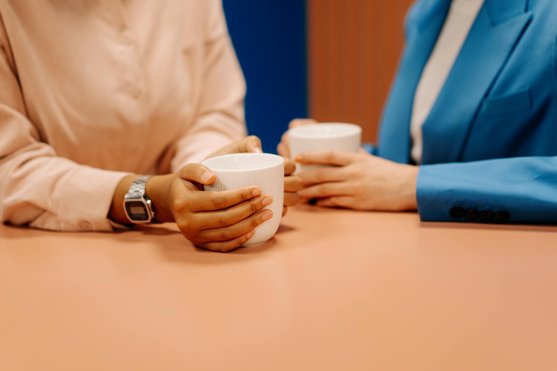 person holding white plastic cup